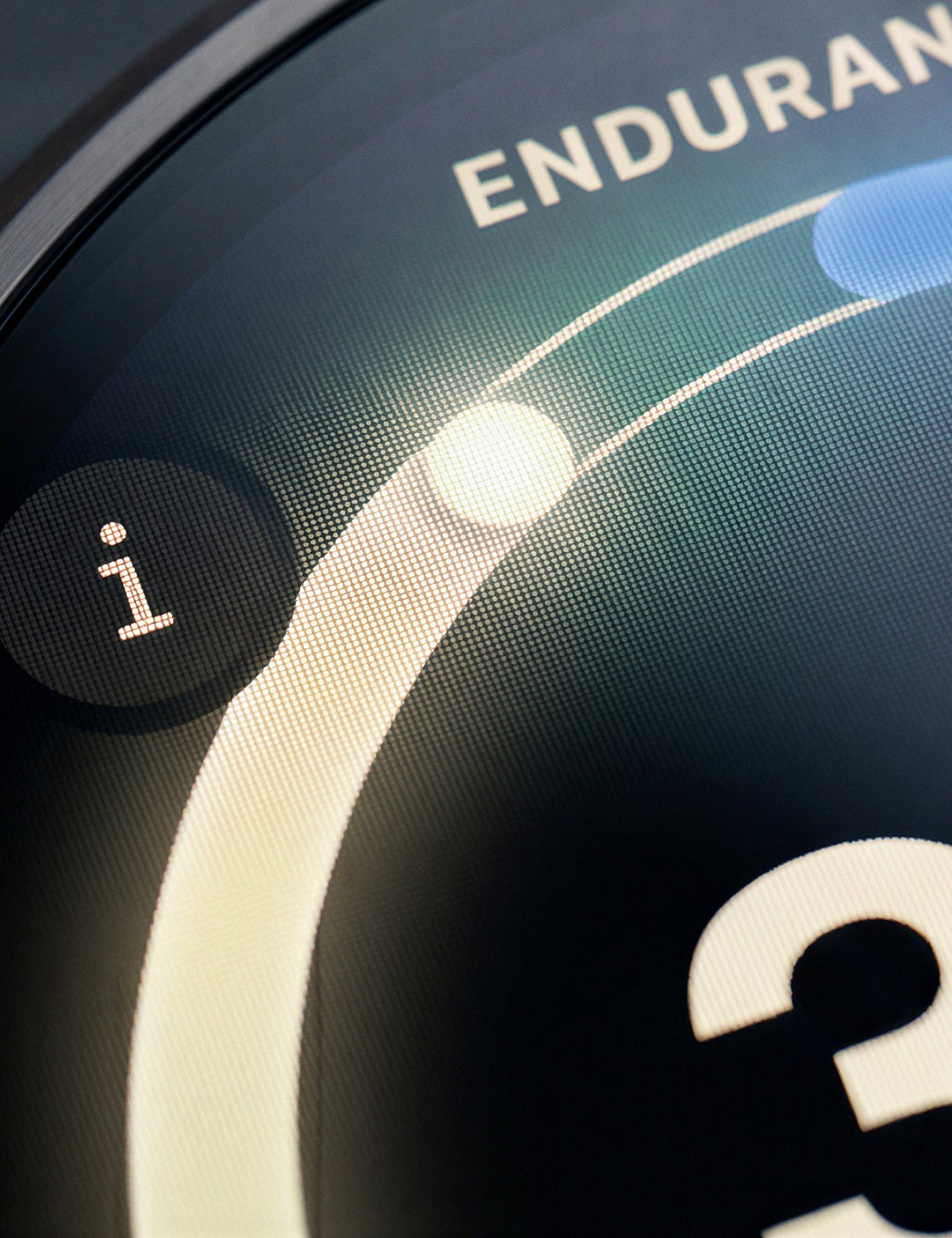 The endurance arc curving along the bezel, pixels visible at macro range.